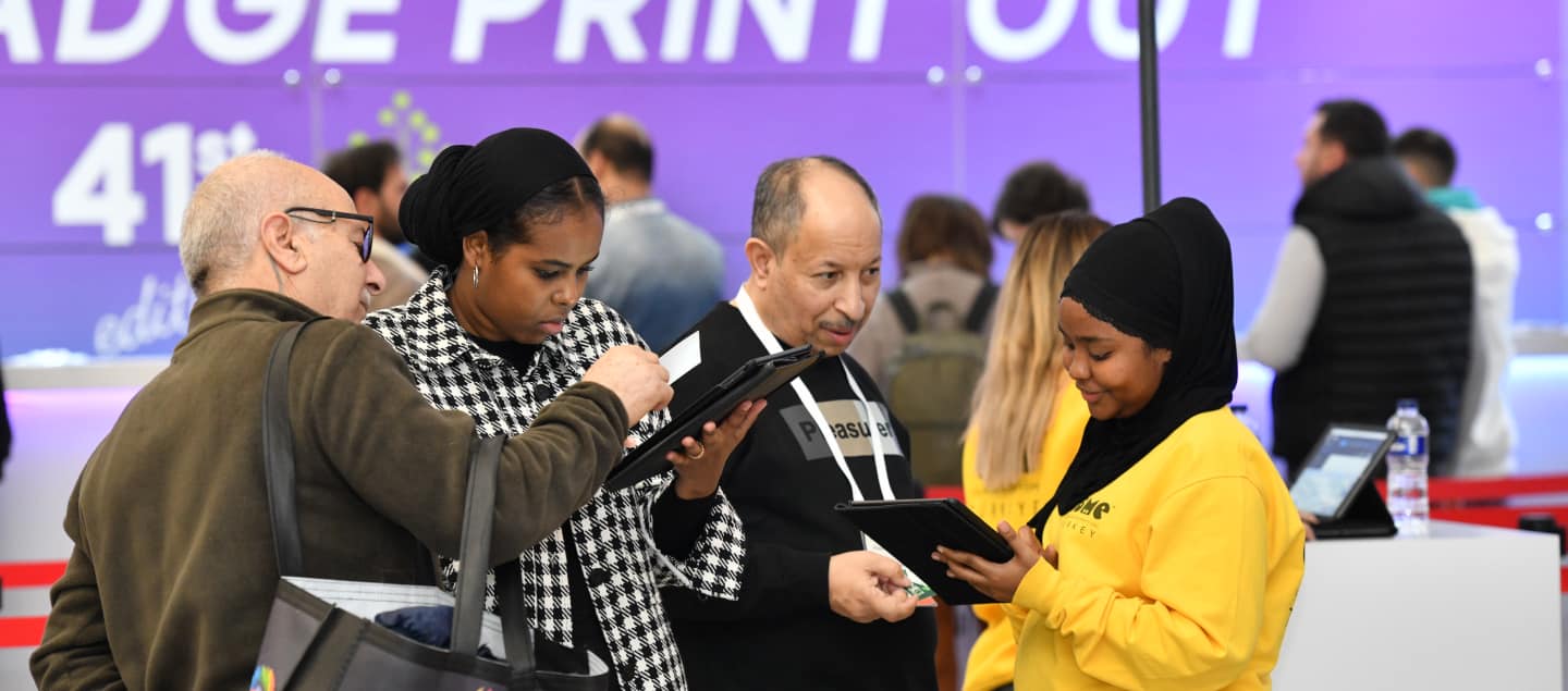 Visitors completing their onsite registrations with assistance from venue hostesses at CBME Türkiye.