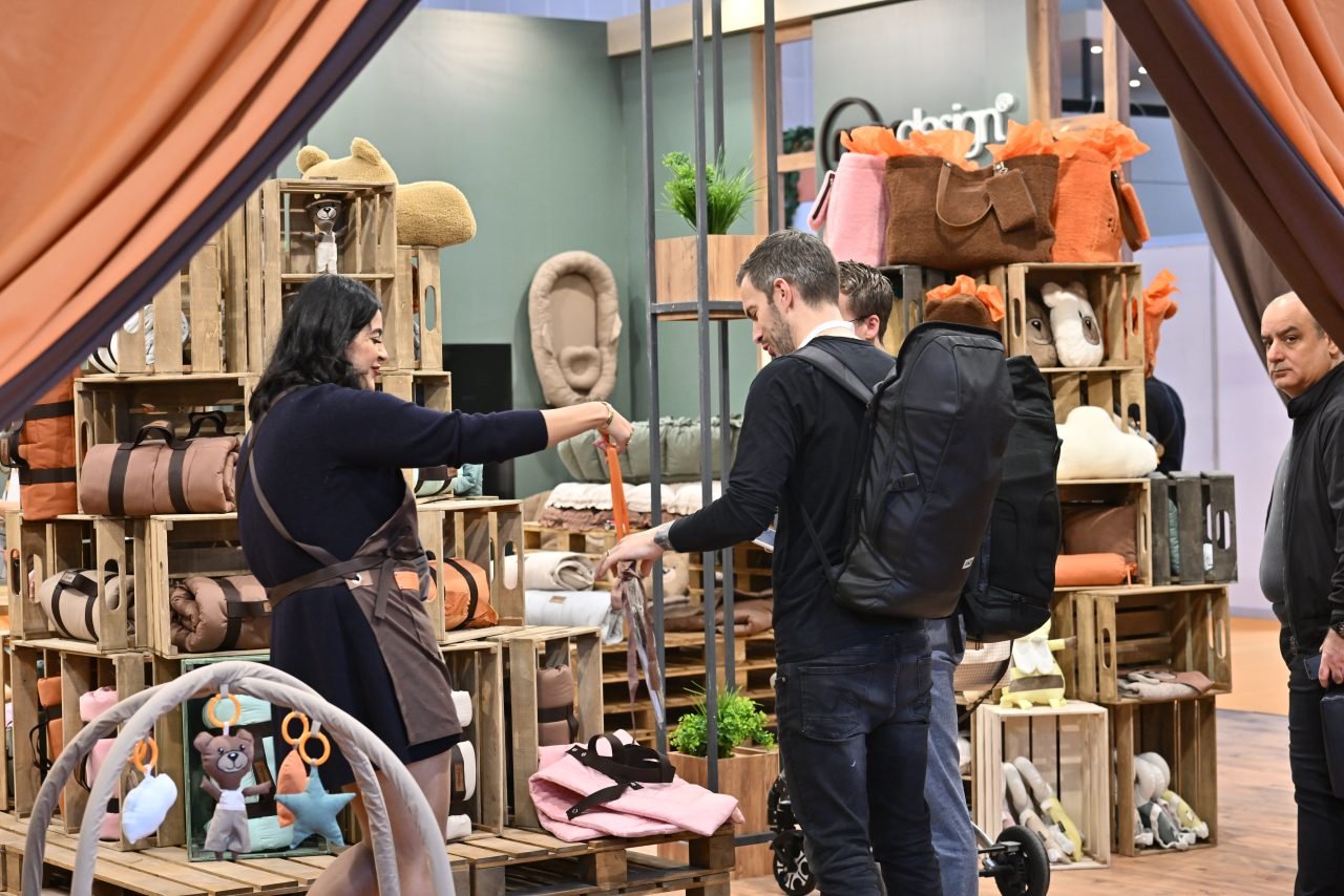 Wide selection of garments displayed on clothing racks at CBME Türkiye.