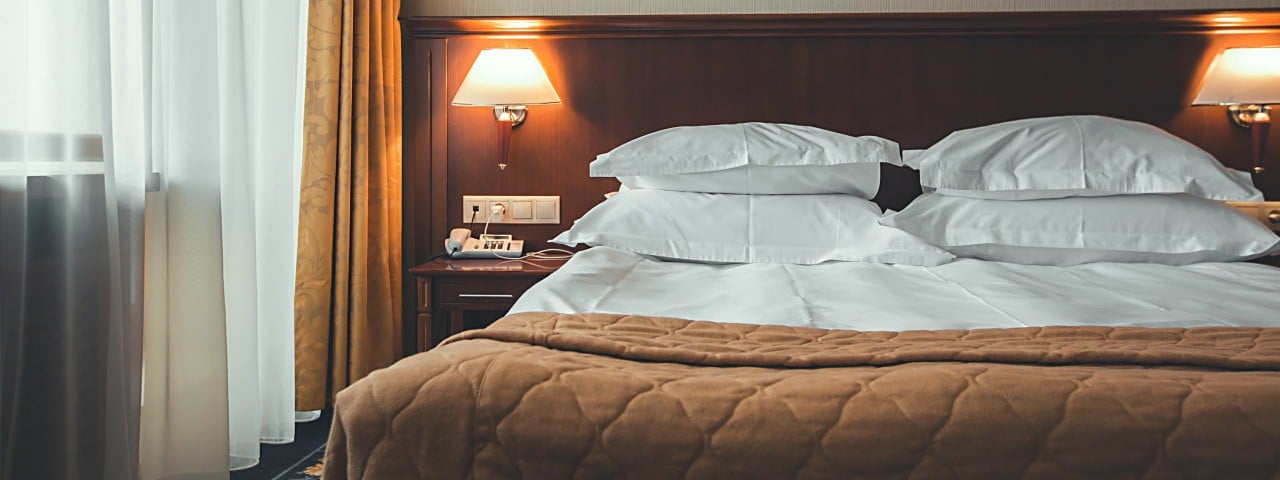 A luxurious and comfortable hotel room at CBME Türkiye with premium furnishings and elegant decor.