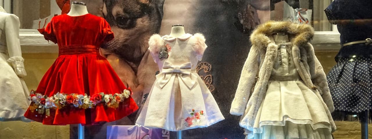 Three dresses in varying colors displayed side by side.