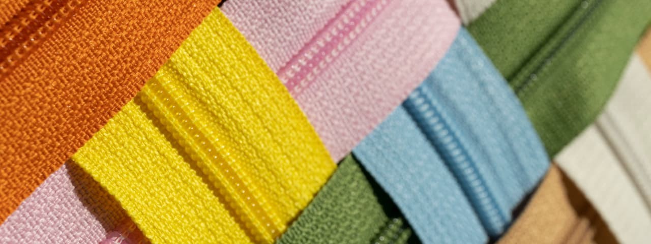 Various colored fabrics intricately intertwined together.