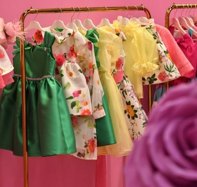 Colorful dresses displayed on hangers at the CBME Türkiye exhibition