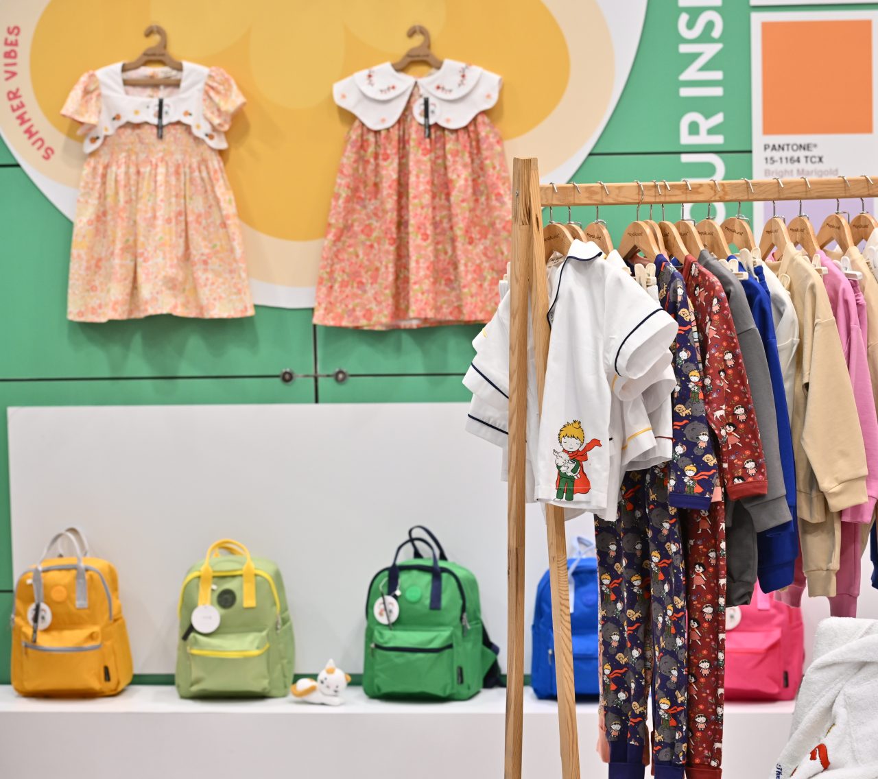 Colorful dresses displayed on hangers at the CBME Türkiye exhibition