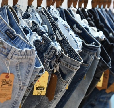 Jeans hanging on a rack at the CBME Türkiye exhibition