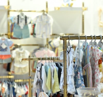 Wide selection of garments displayed on clothing racks at CBME Türkiye.